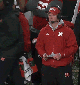 Scott Frost jumping on the sideline gif